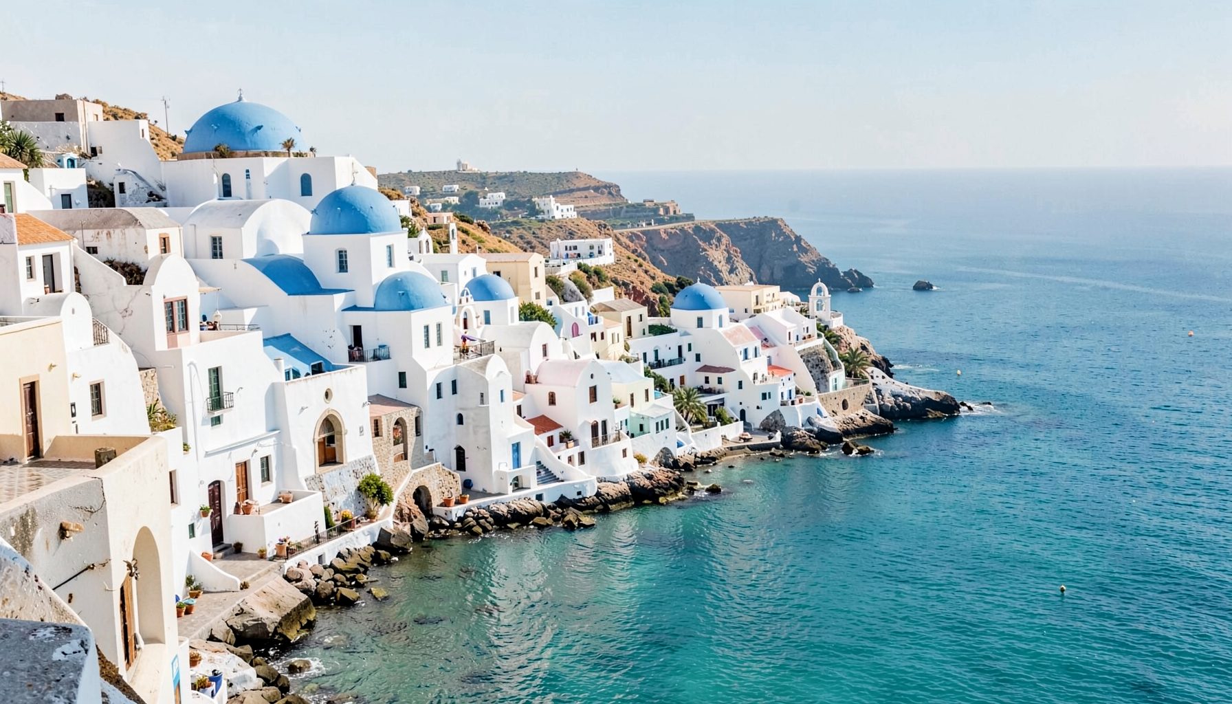 Sunlit whitewashed coastal village with blue-domed churches overlooking a calm turquoise sea, warm and inviting Mediterranean atmosphere